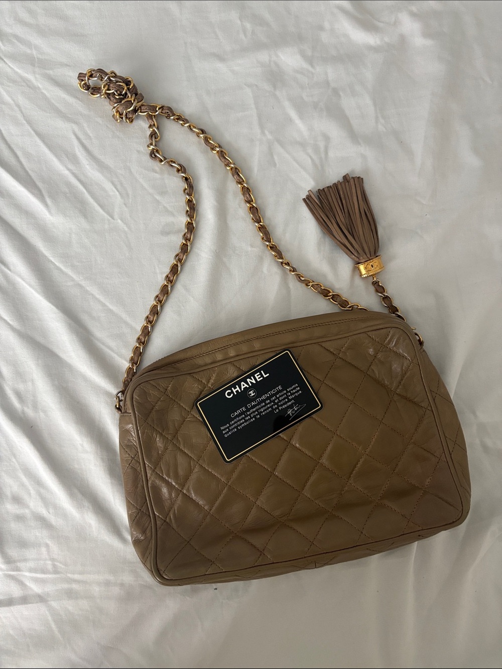 CHANEL Quilted Brown Leather Shoulder Bag with Gold-Tone Chain & Tassel